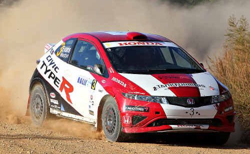 Eli Evans throws up dust in his Honda Civic R Type rally car. Eli Evans throws up dust in his Honda Civic R Type rally car.